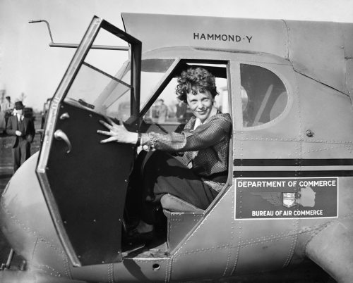 Image of Amelia Earhart sitting in a plane
